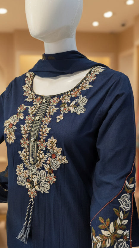Close-up of floral embroidery on navy blue kurti neckline