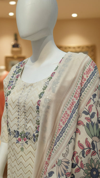 Close up of cream kurta with zigzag pattern, mirror work and floral embroidery